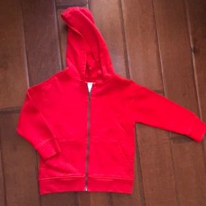 ZARA red zip hoodie with graphic text.